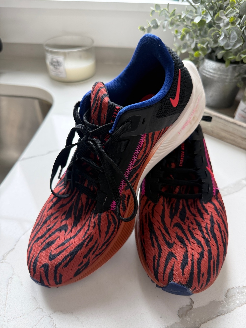 Nike Women’s Red and Black Tiger-Print Running Shoes with Blue Collar